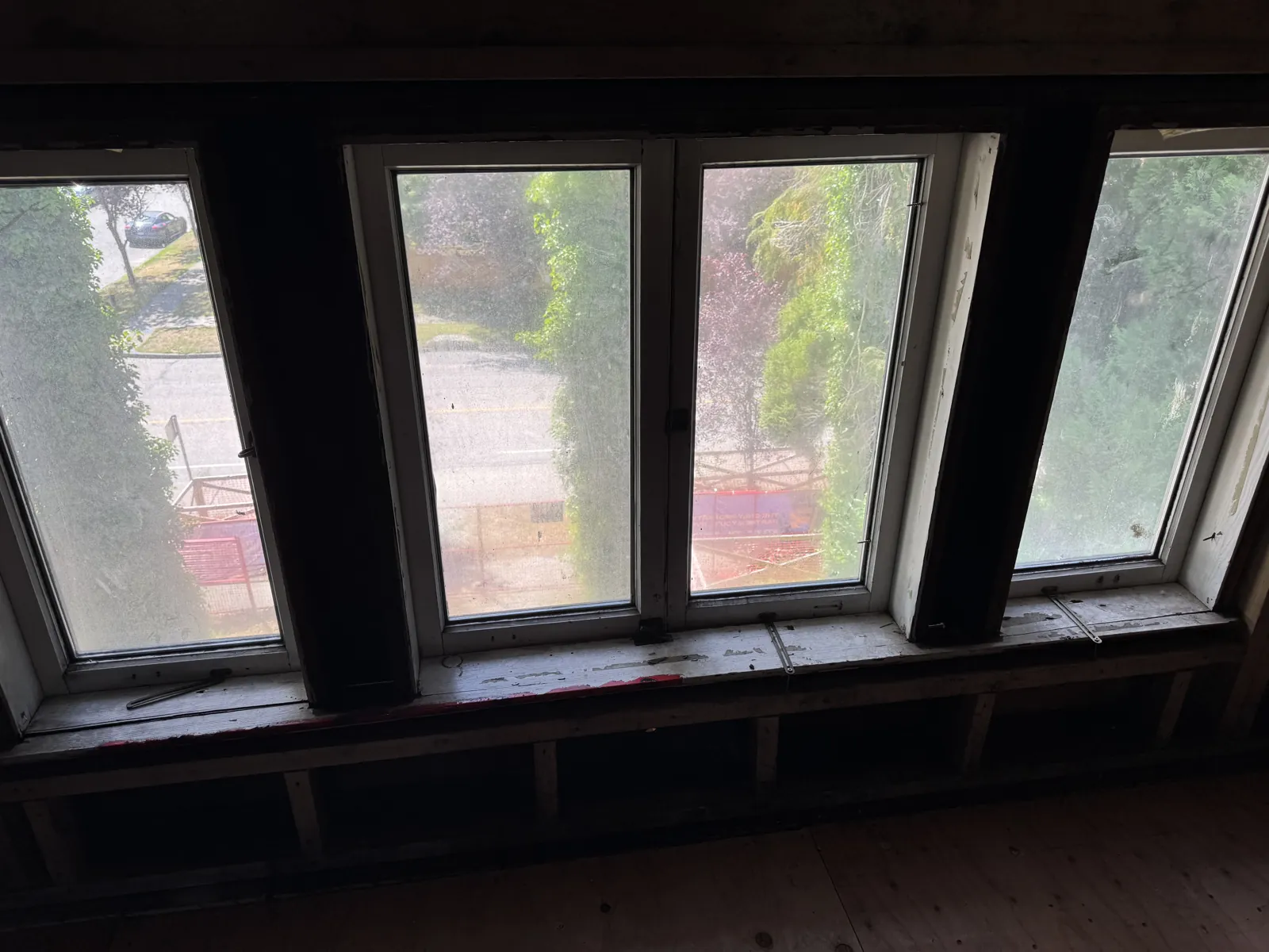 Original wood window bank in a Vancouver heritage Craftsman, before restoration