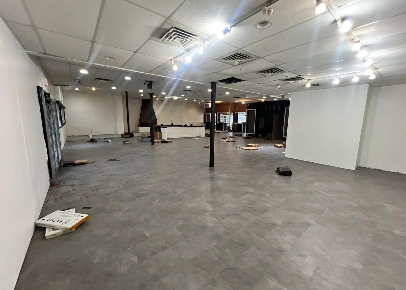 Completed flooring and lighting in the Broadway retail restoration, Vancouver