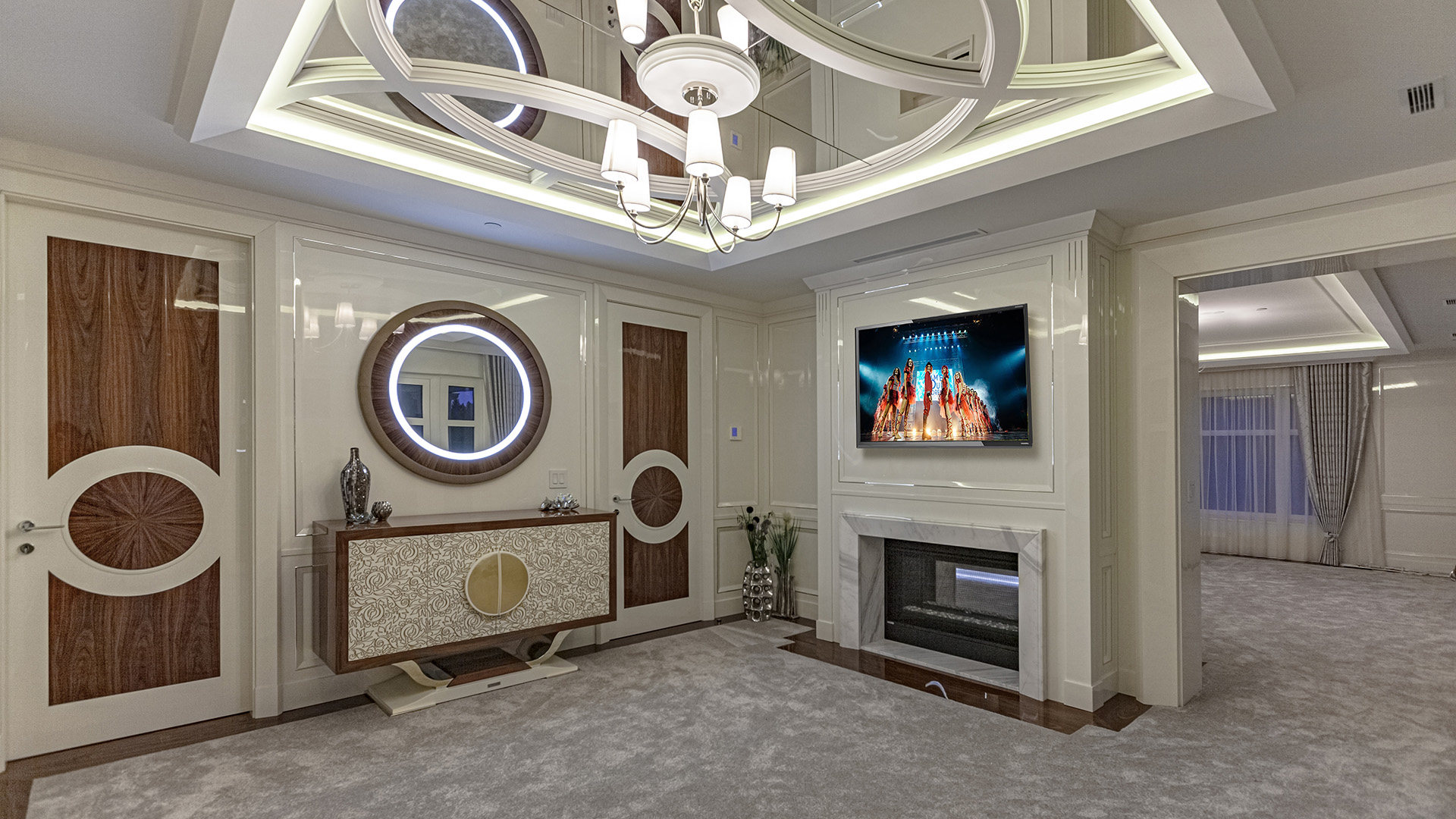 Altamont's Muse primary bedroom with designer ceiling feature and fireplace in West Vancouver