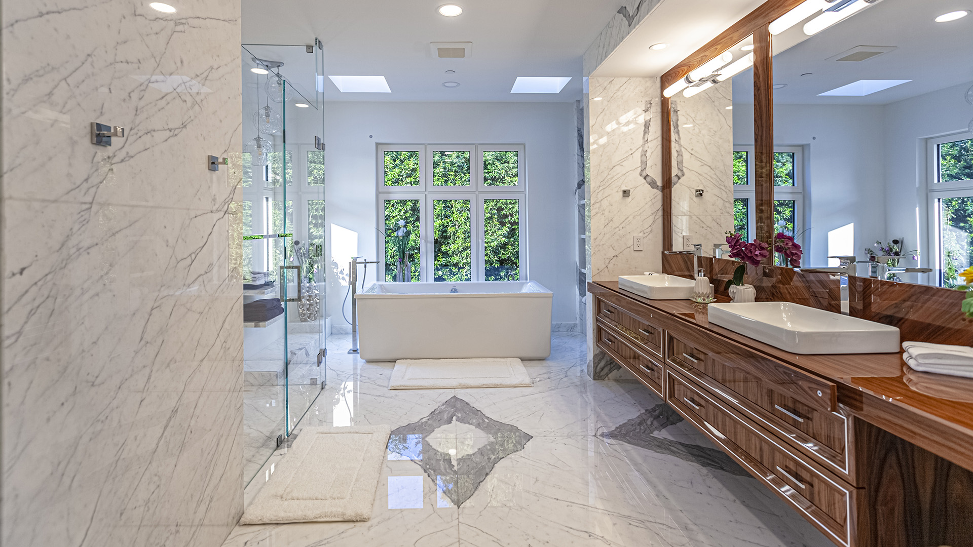 Altamont's Muse primary ensuite bathroom with freestanding tub and marble in West Vancouver