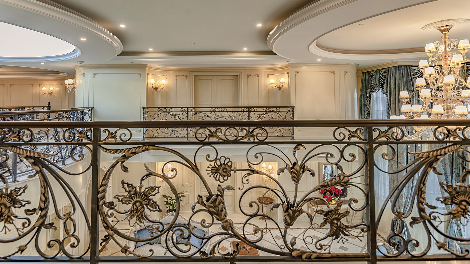 Ambleside Palace hand-forged wrought iron balustrade detail with floral motifs in West Vancouver