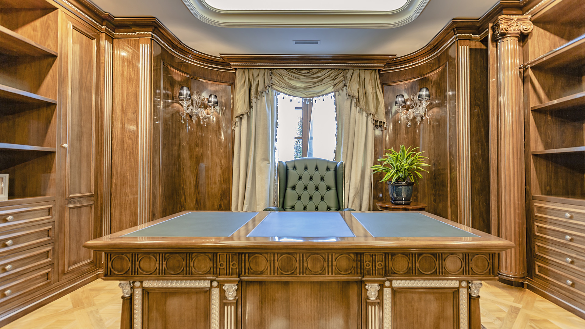 Ambleside Palace study desk detail with skylight and built-in walnut shelving in West Vancouver