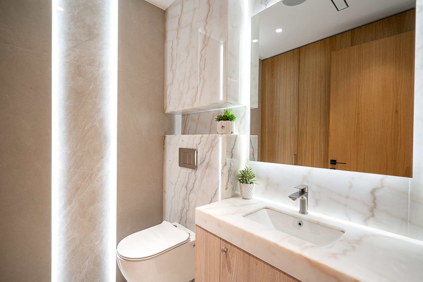 Cedar-lined sauna interior with L-shaped bench and illuminated salt stone panels luxury West Vancouver home