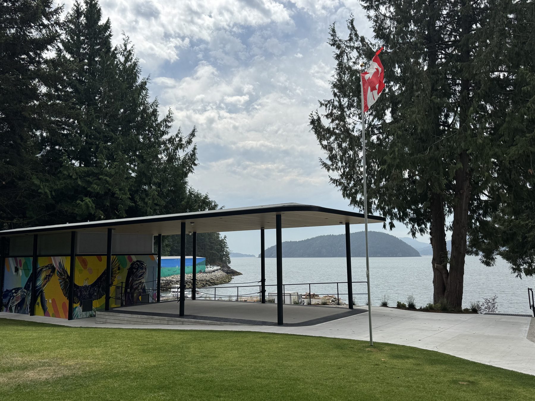 Completed covered pavilion at Lions Bay Beach Park with Howe Sound and Bowen Island beyond