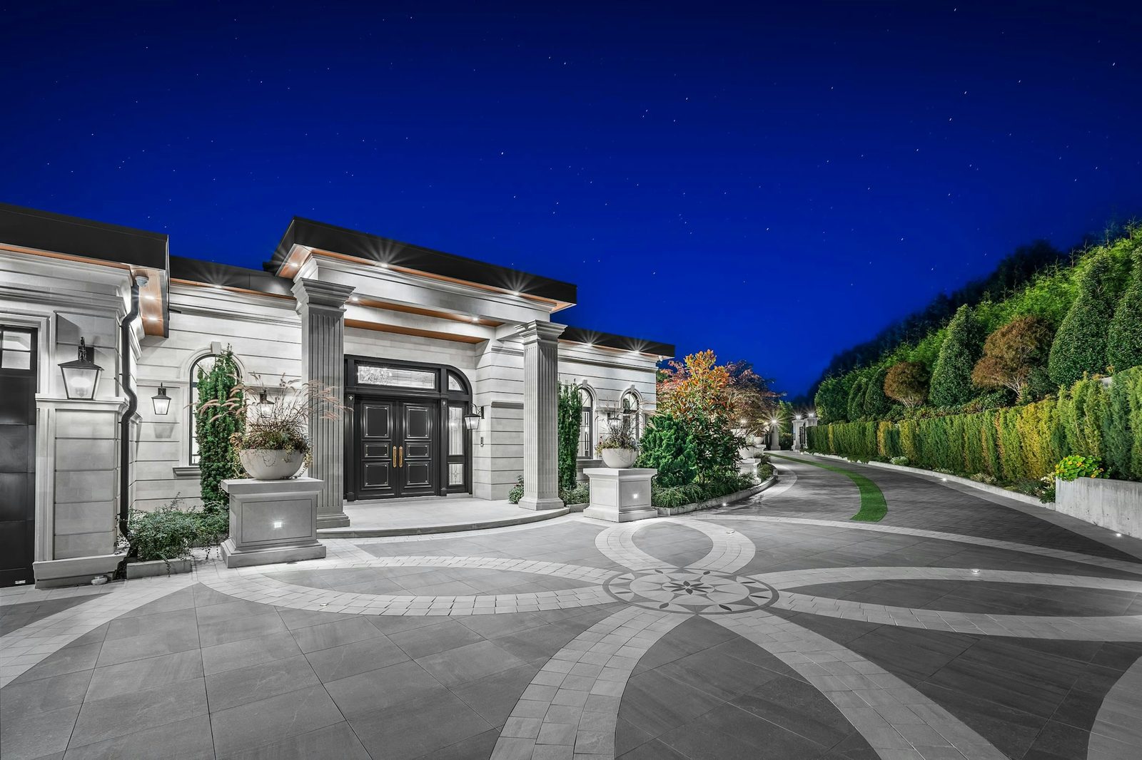 Motor court entrance with compass rose stone medallion at Montbeau Eyremount West Vancouver
