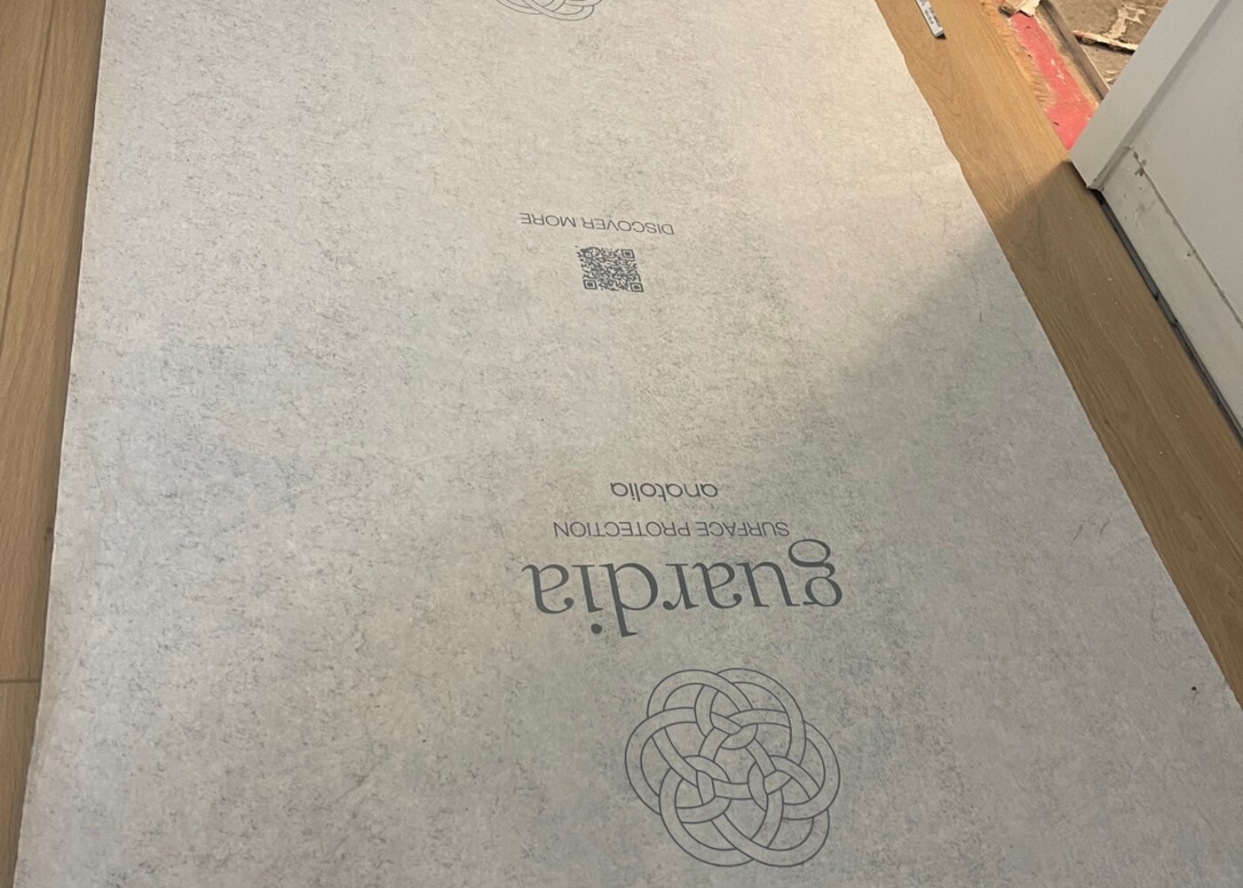 New stair treads installed with Guardia surface protection applied to prevent damage during remaining construction work