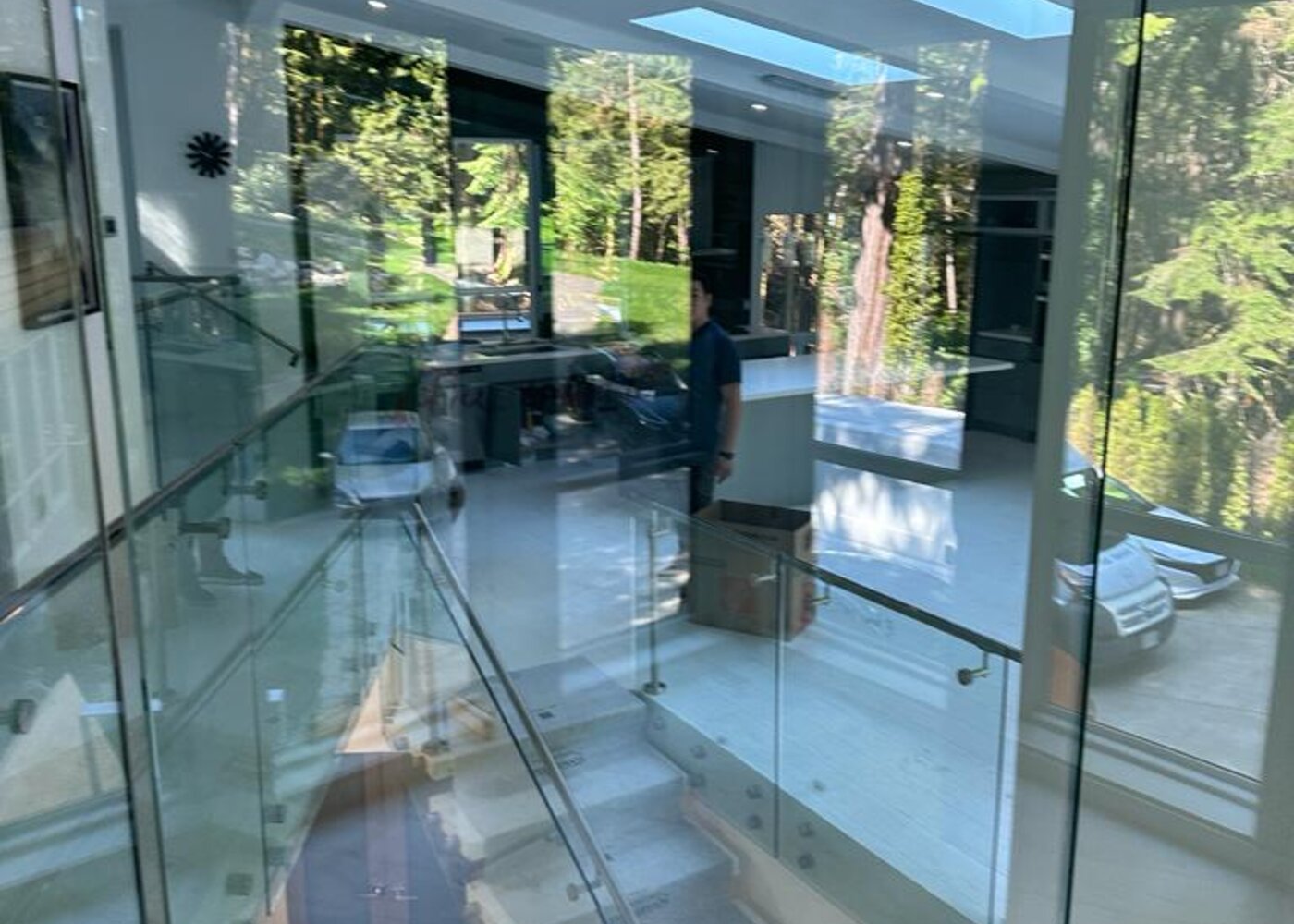 Lower level tile floor at staircase base before restoration at Prospect Road North Vancouver