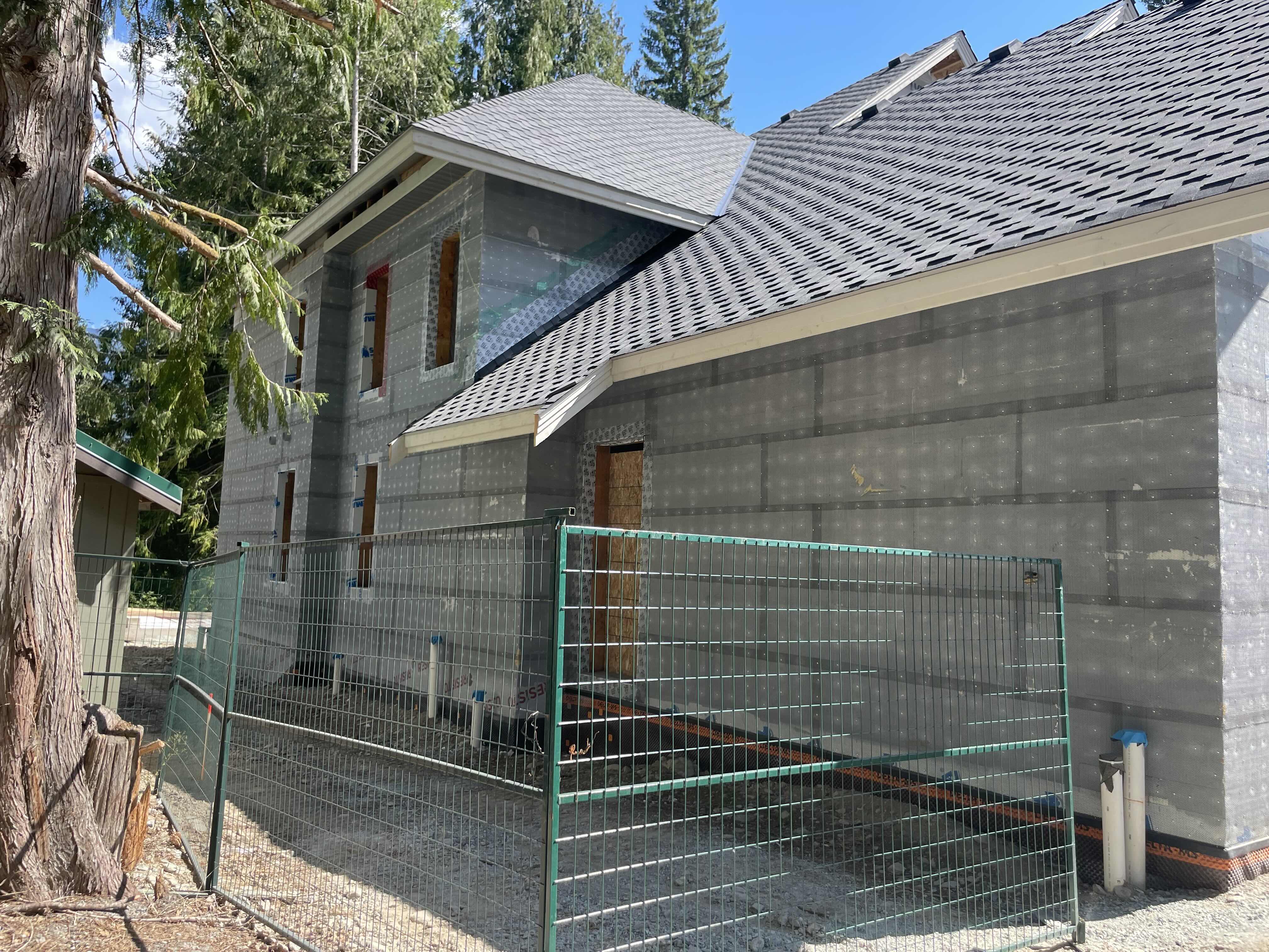 ICF insulated concrete form walls during construction of Rainbow in Whistler showing building wrap and roof sheathing — energy efficient custom home by Eurohouse Construction