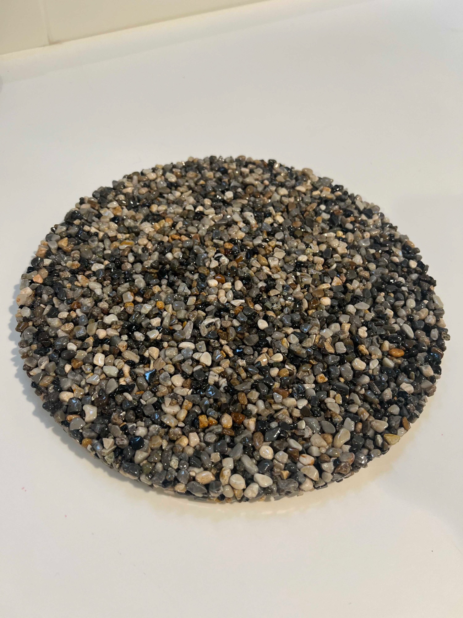 Finished floor sample — exposed aggregate pebble flooring detail for Rennie office West Vancouver