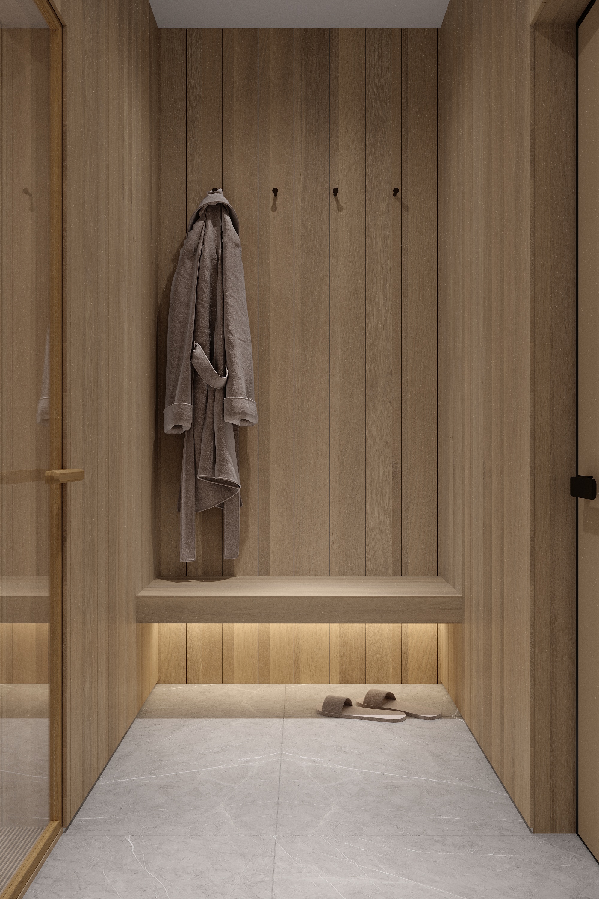 Sauna anteroom with cedar-lined walls and robe hooks at Scandinavian barn house West Vancouver by Eurohouse Construction