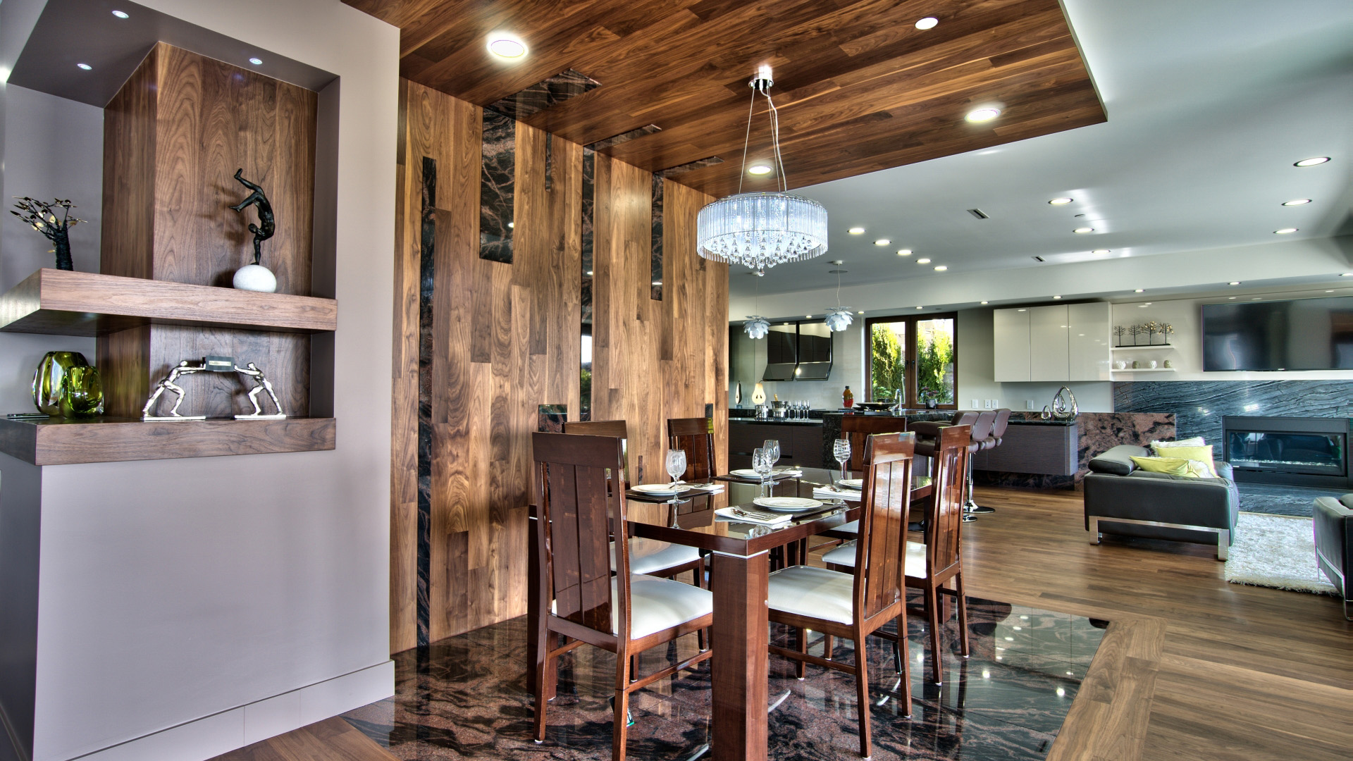 Formal dining room with walnut ceiling panel crystal chandelier marble floor and built-in display shelving luxury West Vancouver home