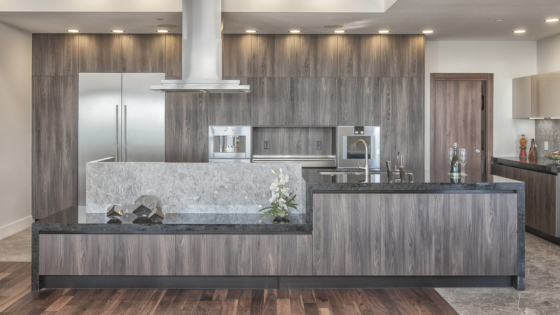 Gourmet kitchen with Italian cabinetry Gaggenau appliances marble and granite countertops walnut flooring West Coast Contemporary British Properties West Vancouver